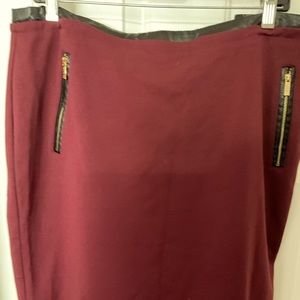 Calvin Klein size 16 burgundy skirt with faux leather trim at waist n pockets.